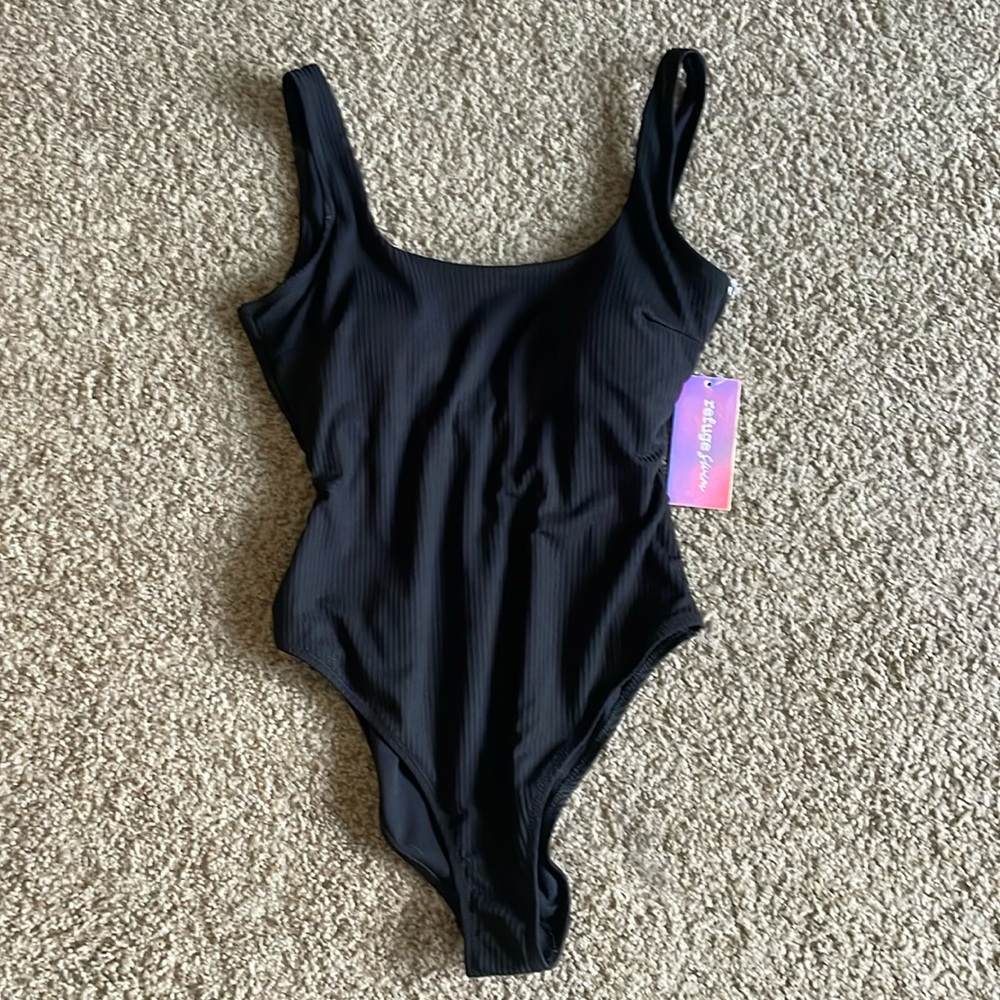 NWT one piece black swim suit. Size small.